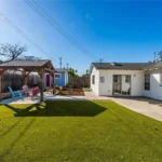 Real Estate backyard with a lawn and patio